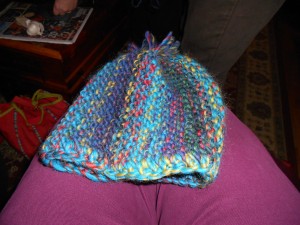 Garter stitch hat knit sideways and gathered at the top.